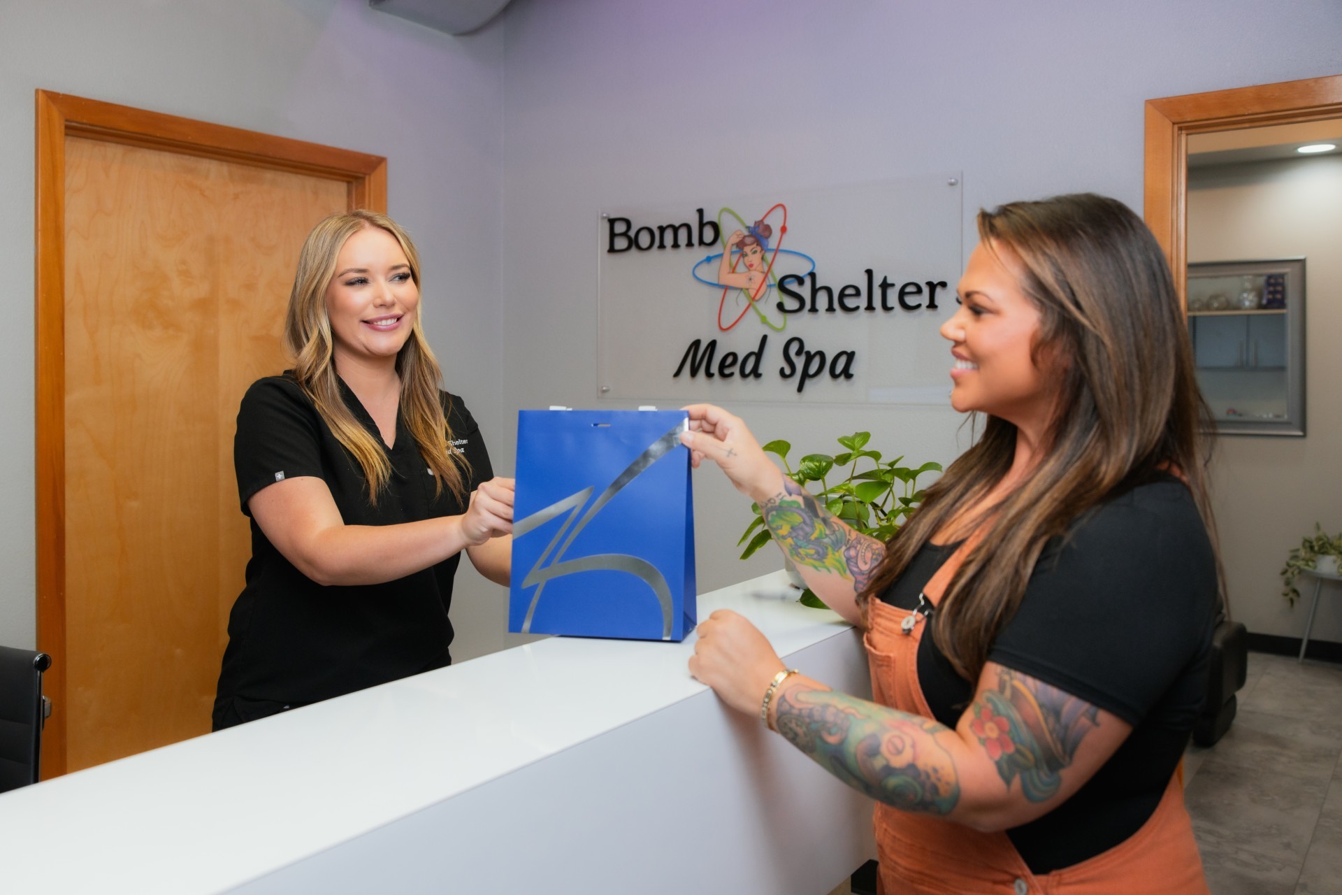 patient at the reception receiving a gift after advanced dermatology services
